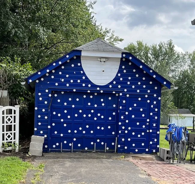 Lucille Ball Hometown Tour: The  garage of her childhood home has a painted dress.